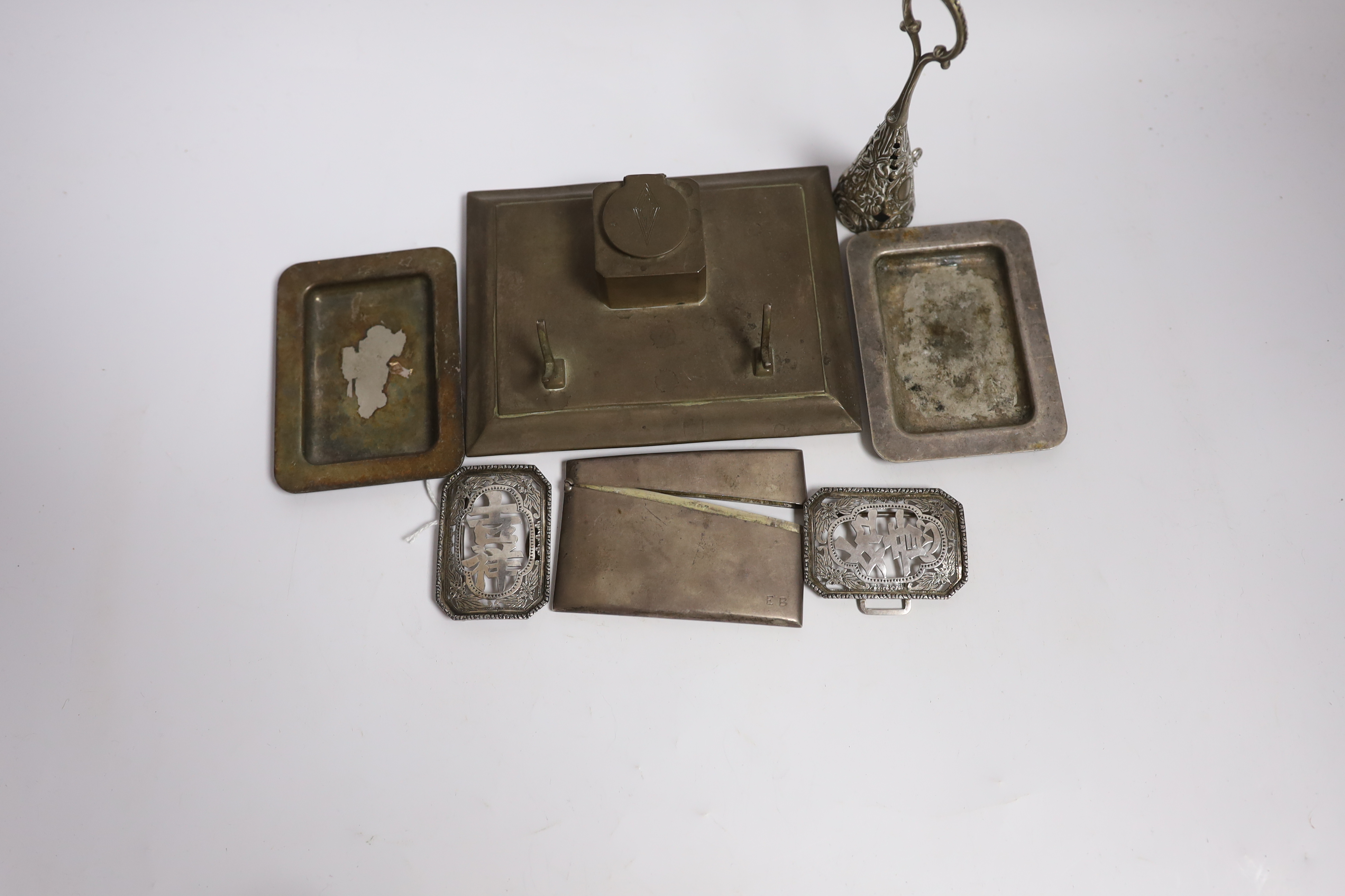 An early 20th century Chinese Export pierced white metal buckle, maker CS?, width 87mm, together with a silver plated card case, inkstand, two dishes and posy holder.